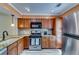 Modern kitchen with stainless steel appliances, granite countertops, and stylish cabinetry at 2972 Aspen Woods Entry, Atlanta, GA 30360