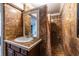 Elegant bathroom featuring decorative tiling, custom vanity, and shower at 5410 Rosser Rd, Stone Mountain, GA 30087