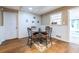 Charming dining area featuring hardwood floors and a view to the backyard at 5410 Rosser Rd, Stone Mountain, GA 30087