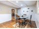 Cozy dining area with hardwood floors, wainscoting, and a view to the living room at 5410 Rosser Rd, Stone Mountain, GA 30087