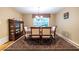 Dining room features a beautiful rug under a table with seating for six, creating a comfortable gathering space at 5410 Rosser Rd, Stone Mountain, GA 30087