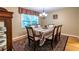 Dining room with hardwood floors and a neutral color palette offers a refined space for Gathering meals and entertaining at 5410 Rosser Rd, Stone Mountain, GA 30087