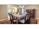 Formal dining room featuring hardwood floors, a chandelier, and classic furniture at 5410 Rosser Rd, Stone Mountain, GA 30087