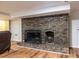 Charming brick fireplace with a decorative design, adding character to the room at 5410 Rosser Rd, Stone Mountain, GA 30087
