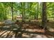 Charming home with a long private driveway, surrounded by mature trees, offering a serene and secluded feel at 5410 Rosser Rd, Stone Mountain, GA 30087