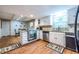 Kitchen featuring granite countertops and stainless steel appliances with an adjacent dining area at 5410 Rosser Rd, Stone Mountain, GA 30087