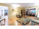 Open-concept living room with hardwood floors and ample seating, seamlessly connects to the dining area at 5410 Rosser Rd, Stone Mountain, GA 30087