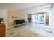 Cozy living room featuring tiled floors, light walls, and abundant natural light at 5410 Rosser Rd, Stone Mountain, GA 30087