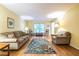 Bright living room features hardwood floors and a view to the dining room, perfect for entertaining and gatherings at 5410 Rosser Rd, Stone Mountain, GA 30087