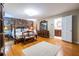 Main bedroom with hardwood floors, a brick accent wall, and an ensuite bathroom provides a luxurious retreat at 5410 Rosser Rd, Stone Mountain, GA 30087