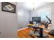 Functional office space with hardwood floors, ample desk space, and natural light at 5410 Rosser Rd, Stone Mountain, GA 30087