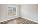 Sun-filled bedroom with hard wood floors and a window overlooking the backyard at 108 Deer Creek Run, Moreland, GA 30259