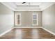 Spacious main bedroom with tray ceilings and hard wood floors with large windows for natural light at 108 Deer Creek Run, Moreland, GA 30259