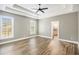 Large main bedroom features hard wood floors, tray ceilings, and an ensuite bathroom at 108 Deer Creek Run, Moreland, GA 30259