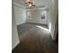 Spacious bedroom featuring neutral carpet, natural lighting, and tray ceiling at 3806 Lockaby Way, Lawrenceville, GA 30044