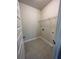 Functional laundry room with tile flooring and shelving, ready for appliances and storage at 3806 Lockaby Way, Lawrenceville, GA 30044