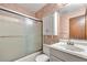 Bathroom with combination shower and tub and white sink at 57 Fair Oaks Se Dr, Conyers, GA 30094