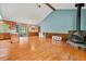 Open-concept living room with hardwood floors, fireplace, and vaulted ceiling at 57 Fair Oaks Se Dr, Conyers, GA 30094