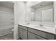 Bright bathroom featuring a double sink vanity, quartz countertops, and a large mirror at 62 Hampton Ter, Dallas, GA 30157
