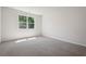Carpeted bedroom offering ample natural light with a window overlooking the backyard at 62 Hampton Ter, Dallas, GA 30157