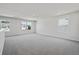 Expansive bonus room with neutral carpet, ample natural light, and views of the surrounding neighborhood at 62 Hampton Ter, Dallas, GA 30157
