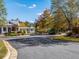View of community entrance with gazebo and meticulously maintained landscaping showcasing fall foliage at 62 Hampton Ter, Dallas, GA 30157