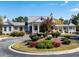 Charming community entrance with a gazebo and beautiful landscaping on a sunny day at 62 Hampton Ter, Dallas, GA 30157