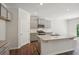 Spacious kitchen with granite countertops, stainless steel appliances, and gray cabinets at 62 Hampton Ter, Dallas, GA 30157