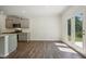 Open-concept kitchen with stainless steel appliances, granite countertops and an eat-in area at 62 Hampton Ter, Dallas, GA 30157