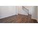 Open-concept living area featuring new flooring and a staircase leading to the upper level at 62 Hampton Ter, Dallas, GA 30157