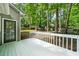 Inviting back deck perfect for outdoor gatherings, offers a serene view of the lush backyard and mature trees at 1359 Chatley Way, Woodstock, GA 30188