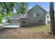 Expansive backyard featuring a charming deck, providing an excellent space for outdoor living and entertaining at 1359 Chatley Way, Woodstock, GA 30188