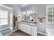 Bright bathroom with double vanity, granite countertop, tile floor, and framed mirrors at 1359 Chatley Way, Woodstock, GA 30188