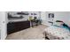 Neutral bedroom with carpet, a full-sized bed, a dresser, and a gaming station at 1359 Chatley Way, Woodstock, GA 30188