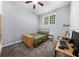 A neutrally painted bedroom featuring carpet and a ceiling fan at 1359 Chatley Way, Woodstock, GA 30188