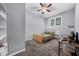 A neutrally painted bedroom featuring carpet and a ceiling fan at 1359 Chatley Way, Woodstock, GA 30188