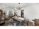 Bright dining room featuring a modern light fixture and sleek table set, creating an inviting atmosphere at 1359 Chatley Way, Woodstock, GA 30188
