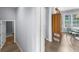 Hallway leads to dining area, with storage cabinet and lots of natural light at 1359 Chatley Way, Woodstock, GA 30188
