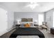 Spacious main bedroom featuring neutral paint, ceiling fan, and plush carpet at 1359 Chatley Way, Woodstock, GA 30188