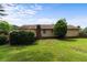 Grassy backyard with mature landscaping and view of the home's exterior at 3802 Birchbriar Ct, Decatur, GA 30034