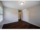 Cozy bedroom featuring hardwood floors, neutral paint, and a double door closet for extra storage at 3802 Birchbriar Ct, Decatur, GA 30034