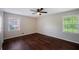 Bright bedroom with hardwood floors and a ceiling fan, offering comfortable living space at 3802 Birchbriar Ct, Decatur, GA 30034