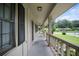 Inviting covered porch of a home featuring a concrete floor and views of the surrounding neighborhood at 3802 Birchbriar Ct, Decatur, GA 30034