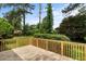 Spacious wooden deck overlooking a private, grassy backyard with mature trees at 3802 Birchbriar Ct, Decatur, GA 30034