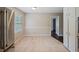 Bright dining area with tile flooring and stainless steel refrigerator at 3802 Birchbriar Ct, Decatur, GA 30034