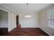 Well-lit dining room with hardwood floors and nearby rooms at 3802 Birchbriar Ct, Decatur, GA 30034