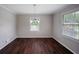 Bright dining room with hardwood floors and stylish chandelier lighting at 3802 Birchbriar Ct, Decatur, GA 30034
