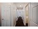 Hallway with hardwood floors leading to bedrooms and bathrooms, providing great flow throughout the home at 3802 Birchbriar Ct, Decatur, GA 30034