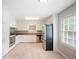 Clean, classic kitchen with white cabinets, stainless steel appliances, and natural light at 3802 Birchbriar Ct, Decatur, GA 30034