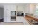 Modern kitchen with stainless steel appliances, double wall ovens and plenty of cabinet space at 3802 Birchbriar Ct, Decatur, GA 30034